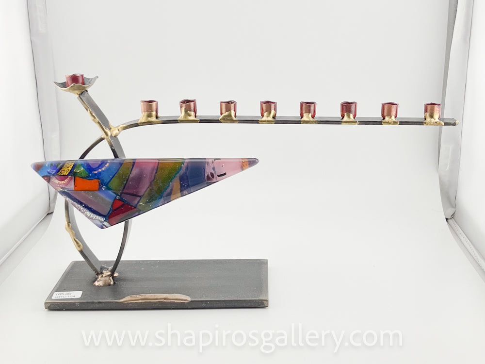 Small curved steel menorah with glass triangle